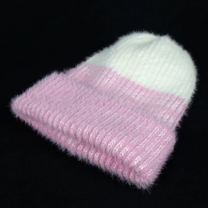 Women's two-tone knit beanie with pink and white faux fur texture for winter warmth