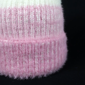 Pink and white faux mink fur knit beanie for women featuring a fuzzy texture and rolled edge