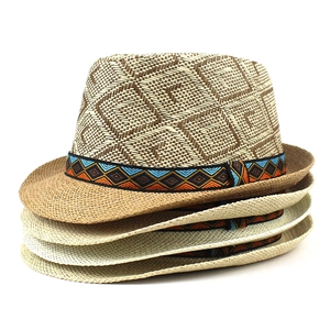 Stack of woven straw fedora hats featuring geometric patterns and ethnic ribbon bands