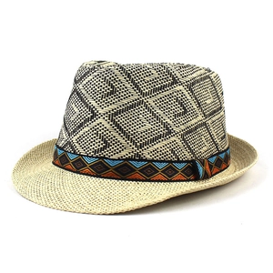 Neutral woven straw jazz fedora hat with black geometric patterns and ethnic band