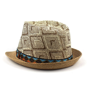 Detailed texture of woven fedora hat with ethnic geometric ribbon and straw pattern