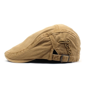 Detail view of khaki cotton beret cap featuring GSIOR side embroidery and metal buckle