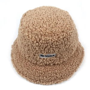Brown fluffy teddy fleece bucket hat for women featuring a stylish rectangular woven label