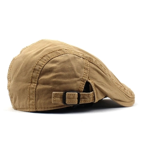 Detail of khaki twill cotton flat cap showing adjustable metal buckle and stitching