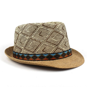 Close-up of diamond pattern straw weave and ethnic geometric ribbon on fedora hat