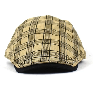 Detail showing khaki plaid linen beret with black trim and breathable fabric texture
