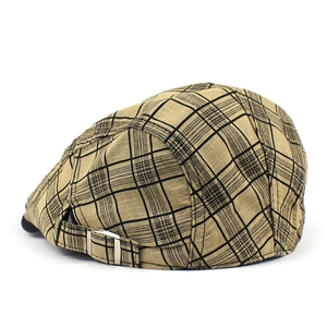 Detail showing the adjustable metal buckle and plaid pattern on the linen beret cap