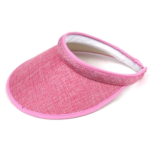 Detail view of pink sun visor hat with woven hemp texture and inner sweatband