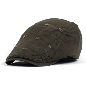 Vintage olive green cotton beret featuring distressed holes and fashion embroidery