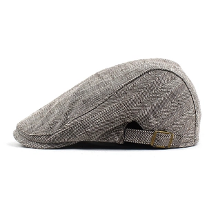 Detail view of cotton herringbone flat cap with adjustable metal side buckle