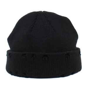 Detail of black ribbed knit beanie featuring distressed ripped edge for streetwear look