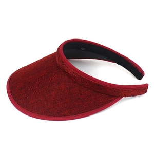 Detail view of burgundy wine-red sun visor hat with textured weave and black sweatband