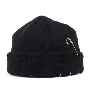 Black distressed knit beanie with metal rings and safety pin in street punk style