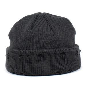 Black distressed knit beanie with ribbed texture and folded cuff for street style