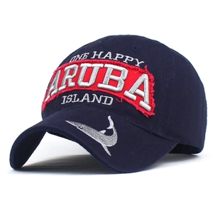 Navy blue cotton baseball cap featuring Aruba embroidery and fish silhouette on the brim