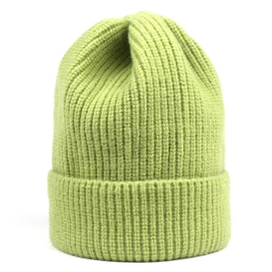 Detail of lime green knit beanie with thick ribbed texture and wide folded cuff