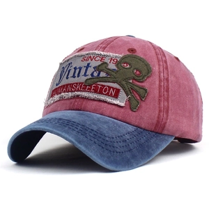 Vintage cotton baseball cap with skull embroidery in contrast red and blue colors