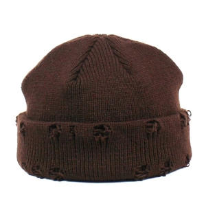 Close-up of dark brown knitted beanie with trendy distressed holes and ribbed texture