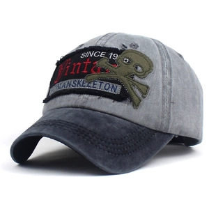 Vintage washed cotton baseball cap with red embroidery and skeleton patch detail