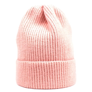 Close-up of pink ribbed knit beanie featuring thick texture and folded cuff for winter warmth