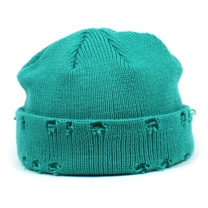 Bright mint green distressed knitted beanie with ripped texture for street fashion
