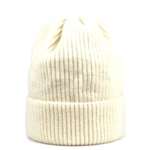 Detailed knit texture of a cream white ribbed beanie with cuffed edge for winter warmth