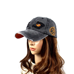 Vintage washed grey cotton baseball cap with orange eye embroidery and distressed brim