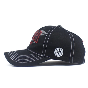 Detail of USA embroidery and white contrast stitching on black cotton baseball cap