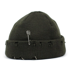 Close-up of olive green beanie with distressed holes and silver metal ring details
