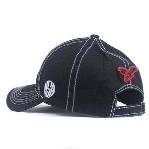 Detail view of USA embroidery and red eagle patch on black washed baseball cap