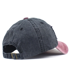 Rear view of washed vintage baseball cap with adjustable metal strap and buckle detail