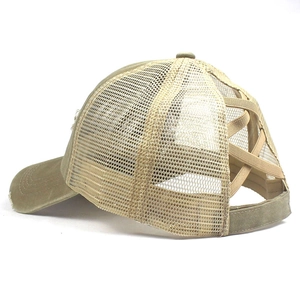 Close-up of the breathable mesh back and elastic criss-cross ponytail hole on baseball cap