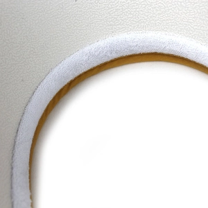 Macro shot of sun hat top opening with soft white terry trim and yellow inner fabric