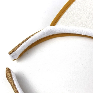Detail of summer sun hat featuring sweat-absorbing white terry lining and yellow fabric edging