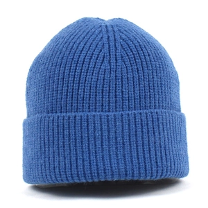 Close-up of royal blue ribbed knit beanie with cuffed design and soft texture