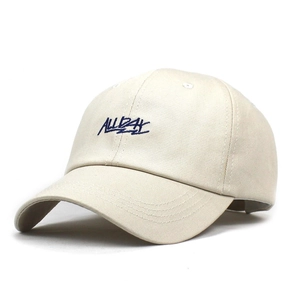 Detailed view of ALLDAY embroidery on a beige cotton canvas baseball cap