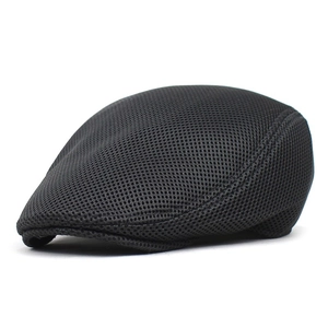 Close-up of black mesh fabric detailing on a breathable summer flat cap for men