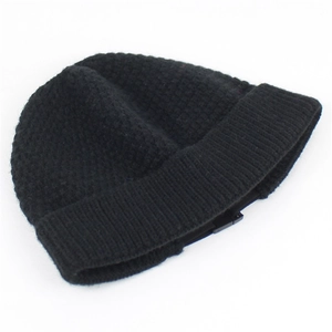 Close-up of the thick ribbed cuff and dense knit texture of this black winter beanie hat