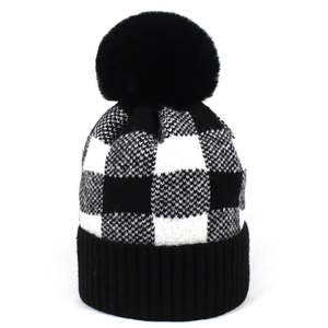 Winter women's black and white buffalo check knit beanie with a fluffy pom-pom top