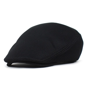 Detail view of breathable black mesh fabric and side buckle on the summer flat cap