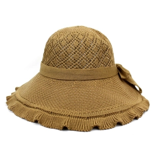 Detail view of khaki knit sun hat featuring bow ribbon and wavy lace-edged wide brim