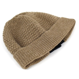 Brown waffle knit beanie hat with a ribbed cuff and adjustable plastic buckle closure