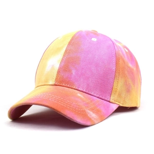 Detail of colorful tie-dye baseball cap with curved brim and reinforced stitching