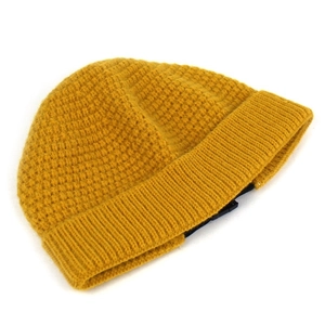 Mustard yellow thick knit beanie hat with a honeycomb texture and wide folded brim for winter