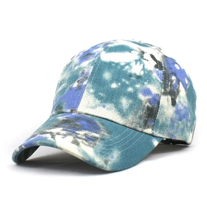 Top view of a cotton tie-dye baseball cap with blue and green street style pattern