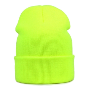 Close-up of neon green winter knit beanie with warm ribbed texture and double fold design