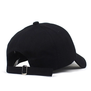 Detailed back view of a black cotton baseball cap showing adjustable metal buckle and strap