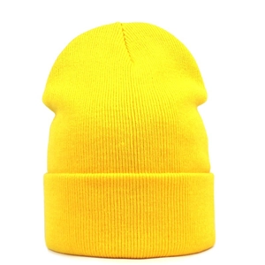 Close-up of bright yellow ribbed knit beanie featuring classic vertical weave and wide cuff