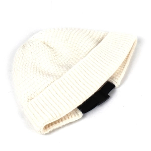 Detail of white chunky knit beanie with wide folded cuff showing high quality wool texture