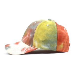 Detail shot of tie-dye baseball cap featuring vibrant colors and reinforced stitching